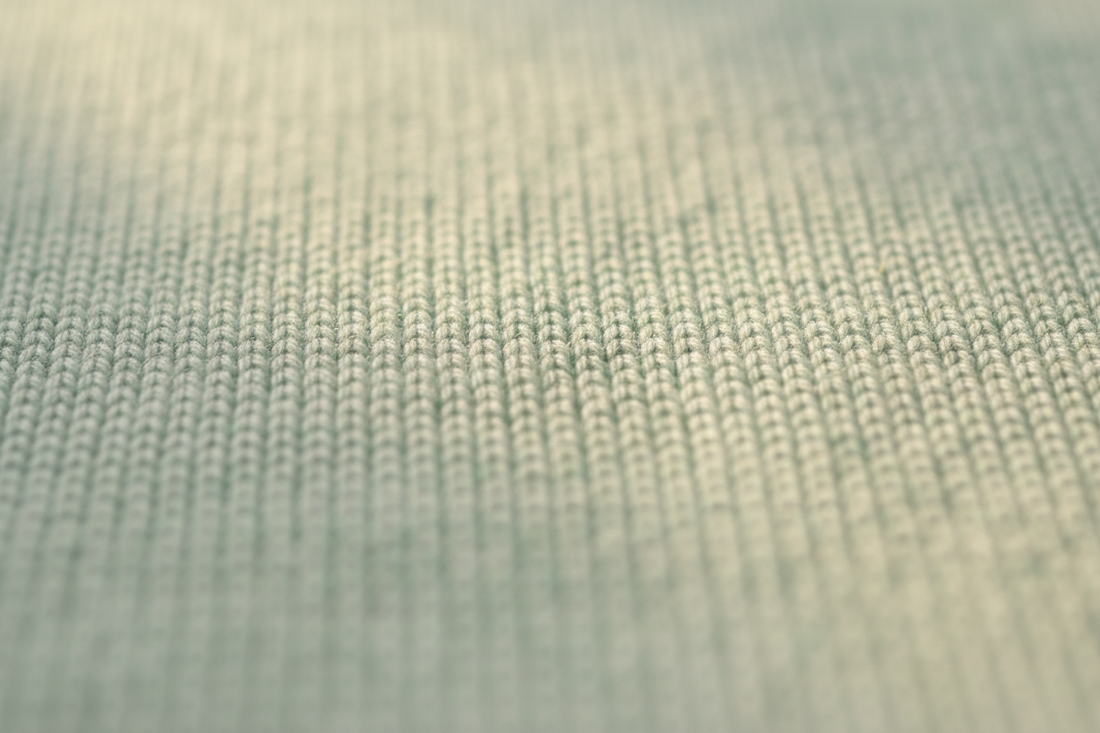 Close-up texture of combed cotton interlock fabric for baby clothes