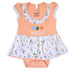 Baby outfit with peach top and floral skirt on a white background