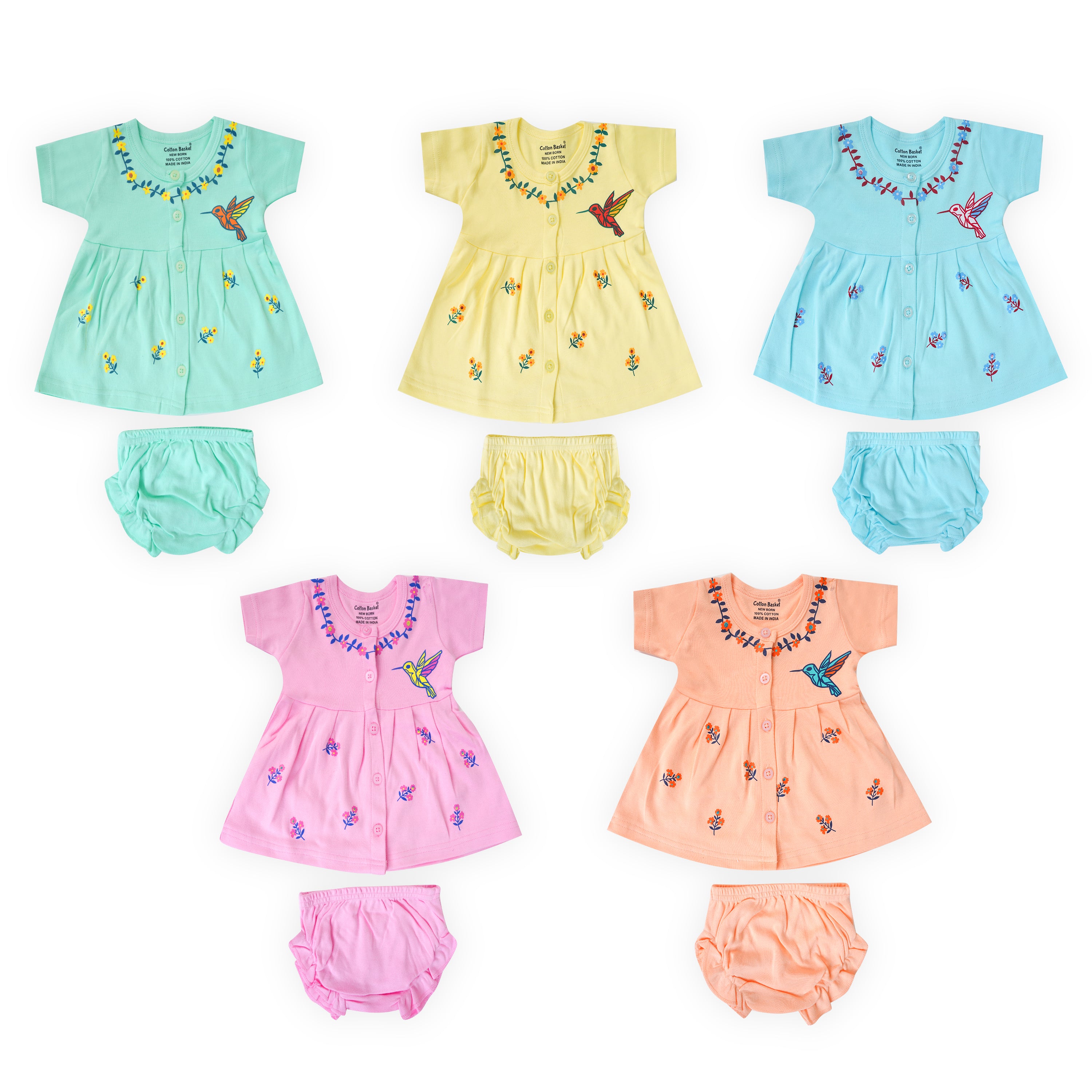Set of colorful baby outfits with dresses and bloomers on a white background